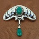 Bernhard Hertz; An Art Nouveau silver brooch with chrysoprase and moonstone Bernhard Hertz; An Art Nouveau silver brooch with chrysoprase and moonstone